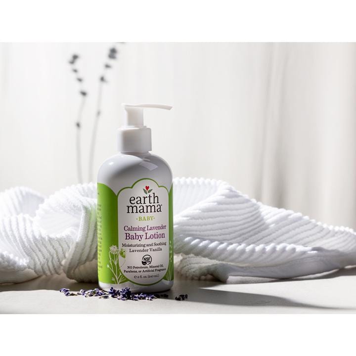 240 ml pump bottle with earth mama label calming lavender baby lotion. White towel in background. Springs of lavender.