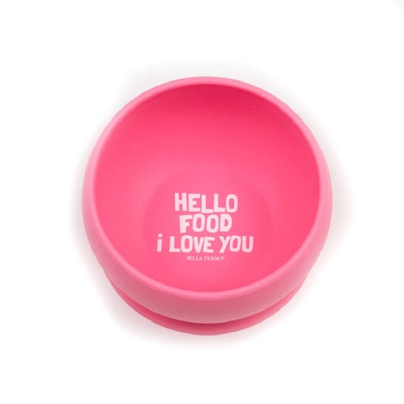 Bella Tunno's Wonder Bowl that suctions to a flat surface. It's pink and says, "Hello food I love you" in white lettering.