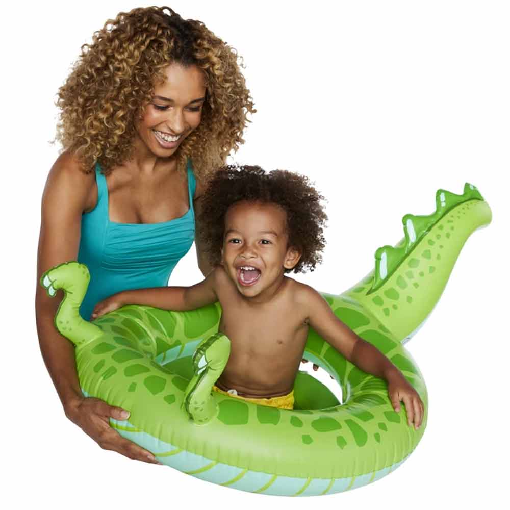 A lady and little boy having a blast in the dino tail float by Big Mouth.