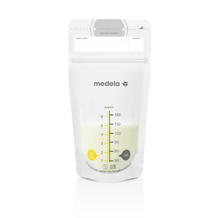 Medela breast milk storage bag with expressed breast milk inside. Standing bag with US ounces and millilitres  inscribed on front of bag.