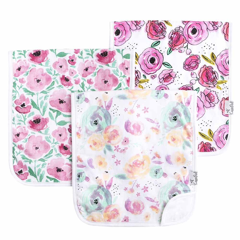 3 burp cloths with different floral patterns