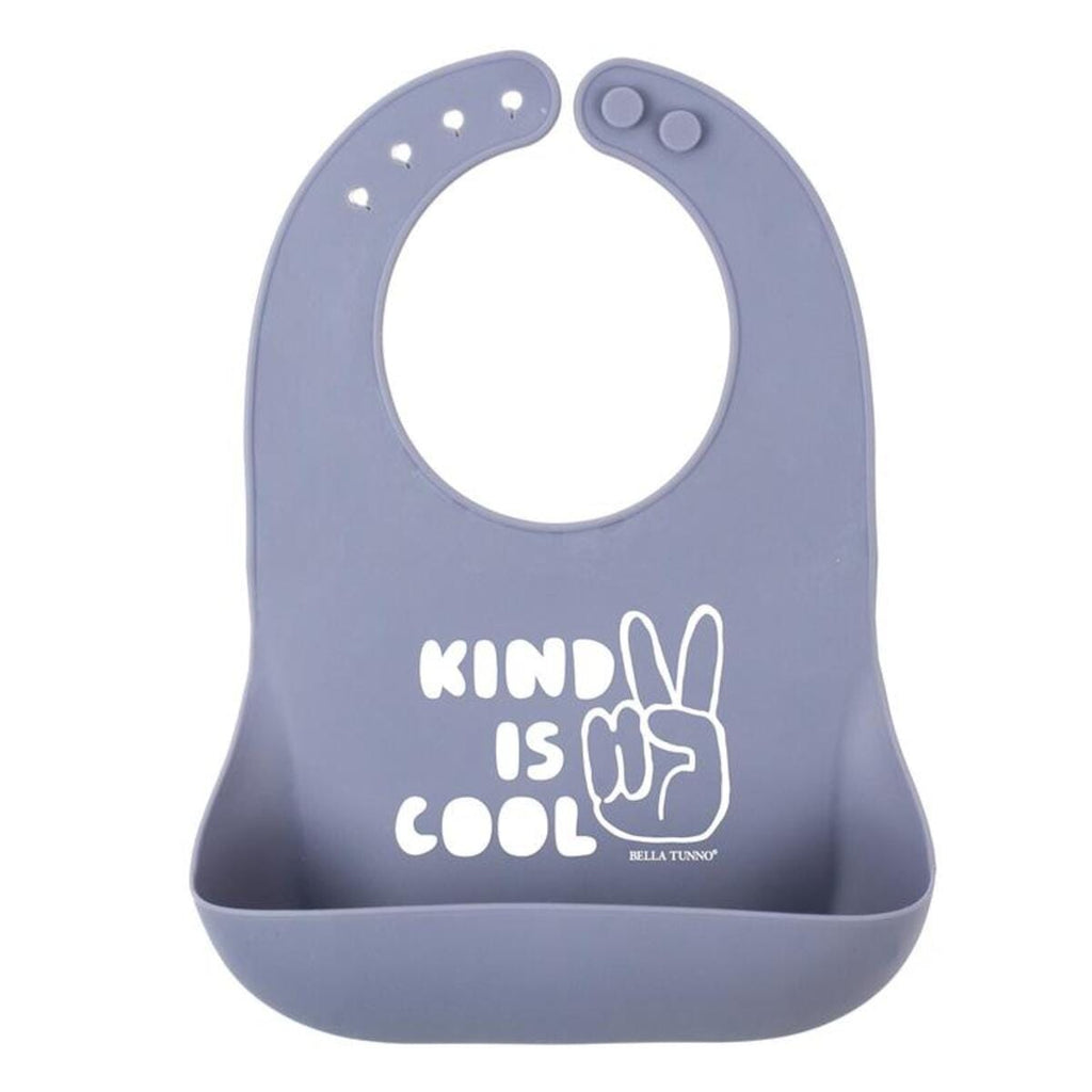 Bella Tunno super bib in purple with 4 adjustable neck sizes and a pocket to catch crubmbs. Has the words "Kind is Cool" with a peace sign in white. 