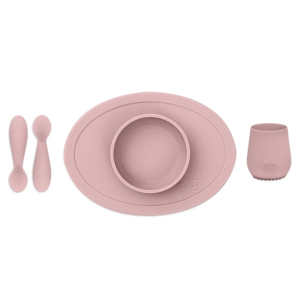 ezpz blush pink first food set includes 2 silicone spoons, a silicone suction bowl and a silicone cup. 