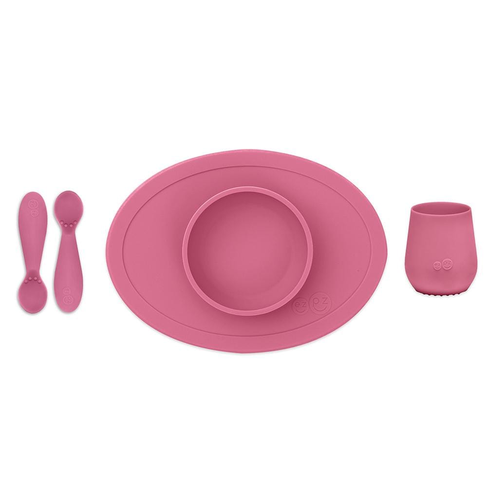 ezpz pink first food set comes with 2 silicone spoons, a silicone suction bowl, a silicone cup
