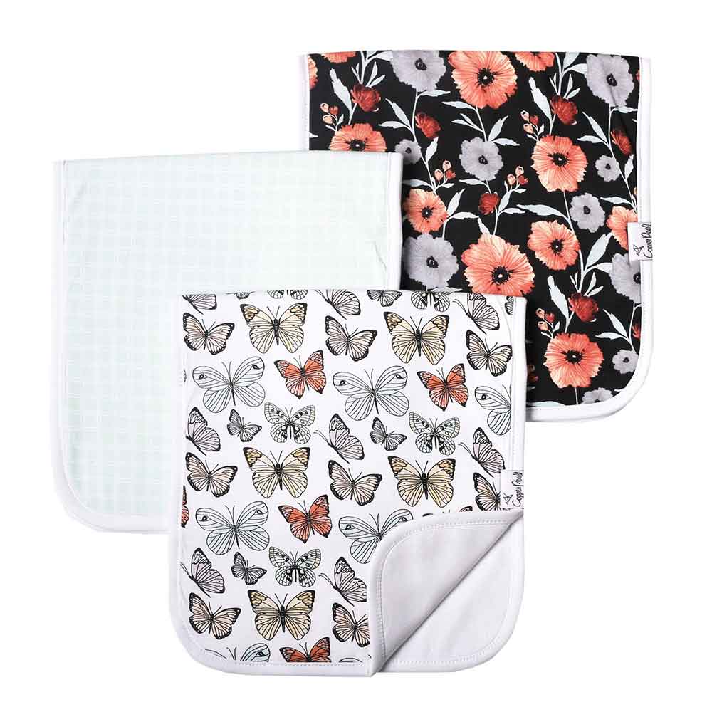 three burp clothes with butterflies, poppies and checkers