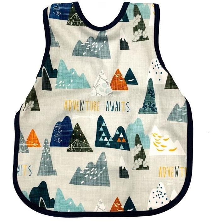 Bapron- bib apron is a hybrid between the two. It is full coverage and ties in the back. This one has blue trim and has mountains on it.