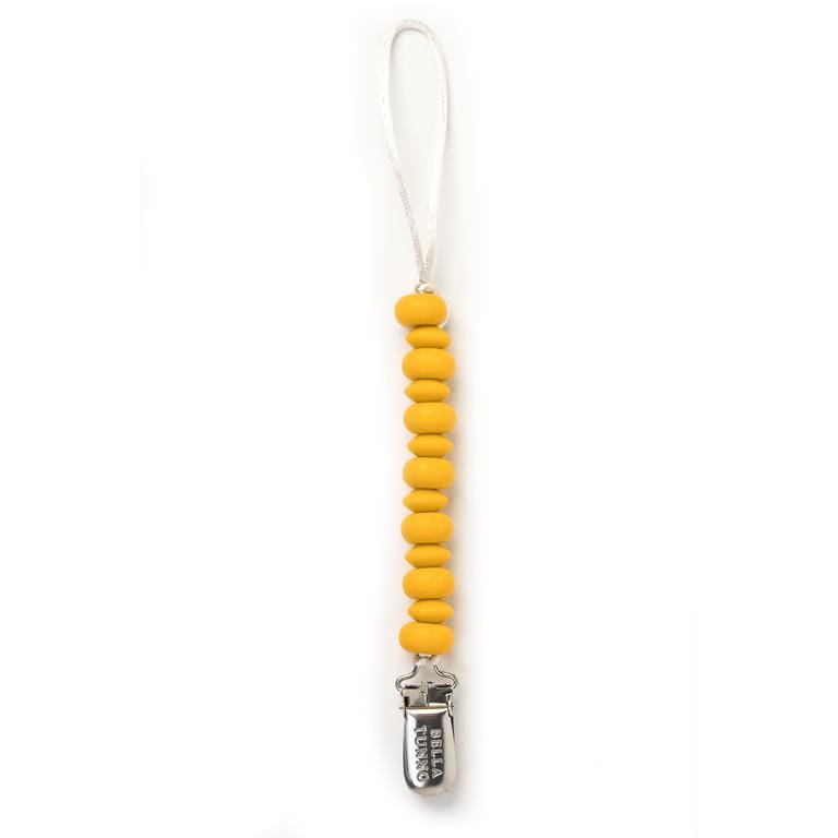 Bella Tunno mustard yellow pacifier clip doubles as a teether and is dishwasher safe. 