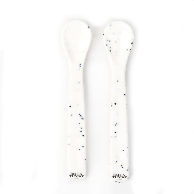 2 Bella Tunno themed silicone and ergonomic spoons. Both are white with black speckles.