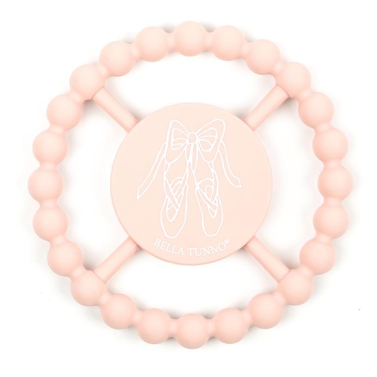Baby pink Bella Tunno teething ring with a design of ballet shoes tied in a bow. 