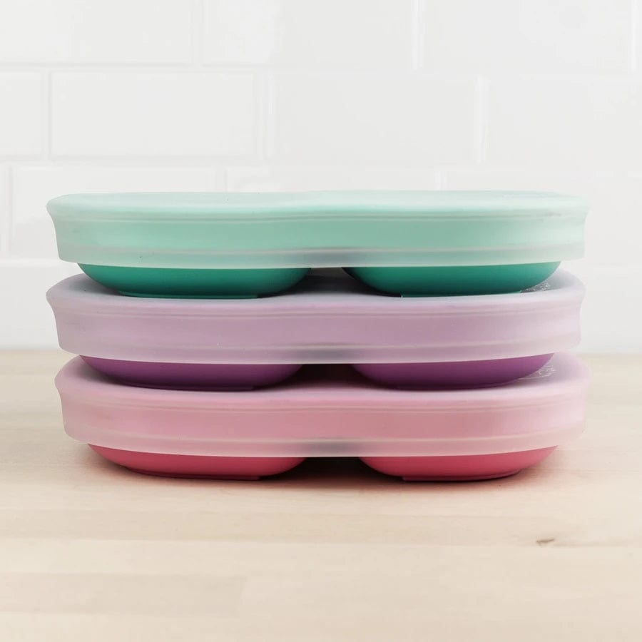 Replay's 7-inch silicone lid, tightly secured on Replay's Divided Plates and stacked to save space.