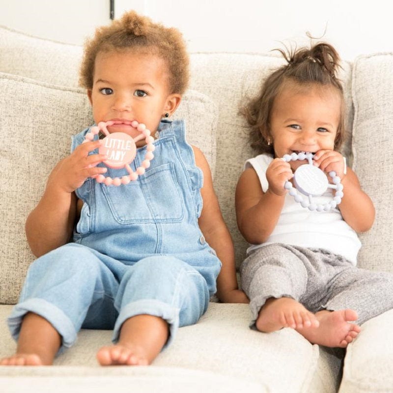 Two little girls enjoying there teethers by Bella Tunno.
