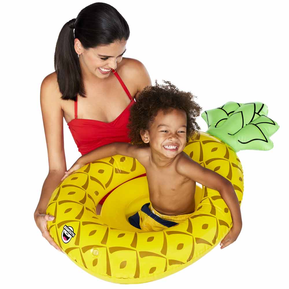 A little boy and lady playing on the Petite Pineapple Lil' Float by Big Mouth.