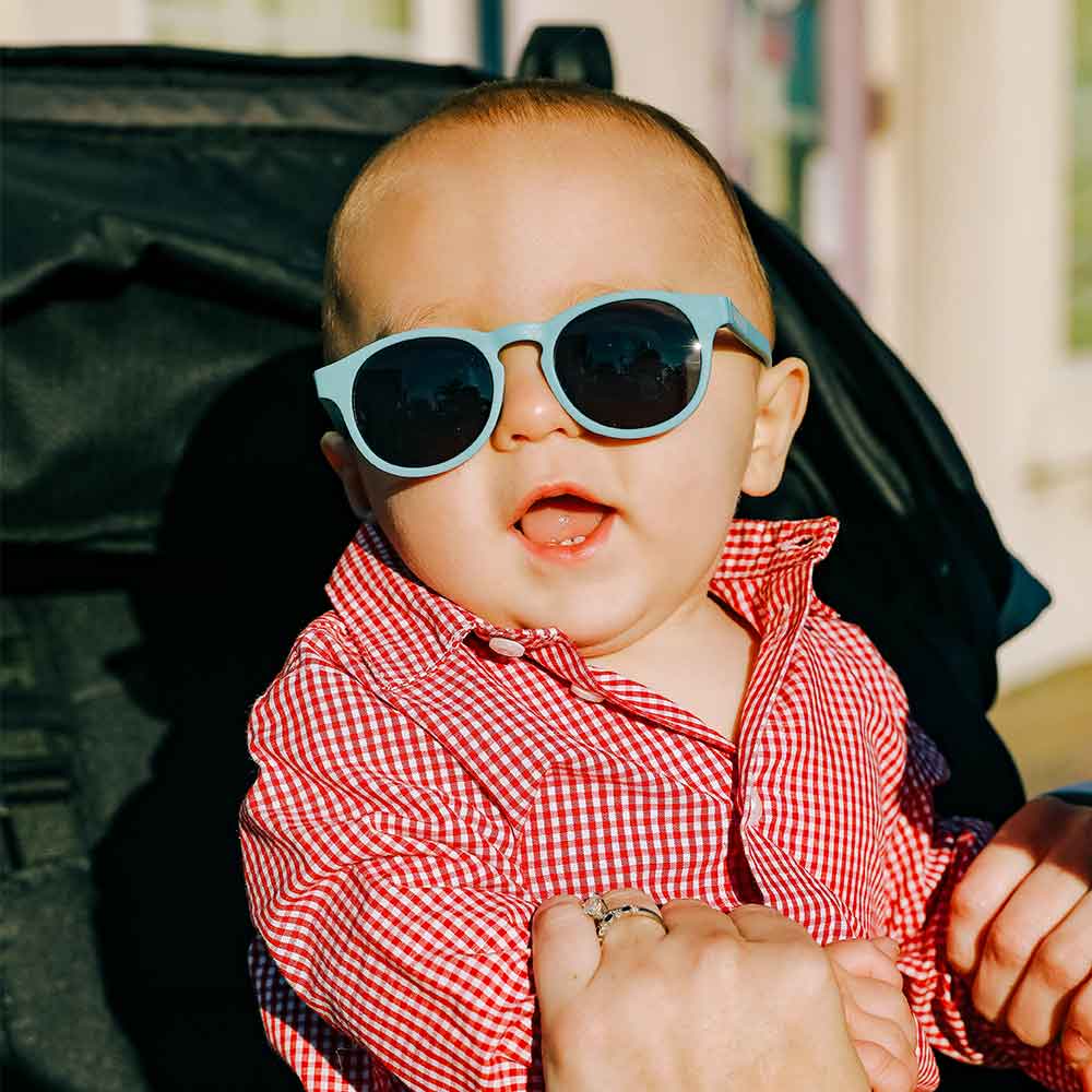 A baby looking stylish with his 'Up in the air' sunglasses by babiator.