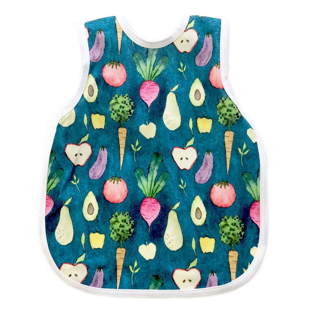 Bapron- bib apron is a hybrid between the two. It is full coverage and ties in the back. This one has a white trim and is covered with fresh fruit and vegetables!