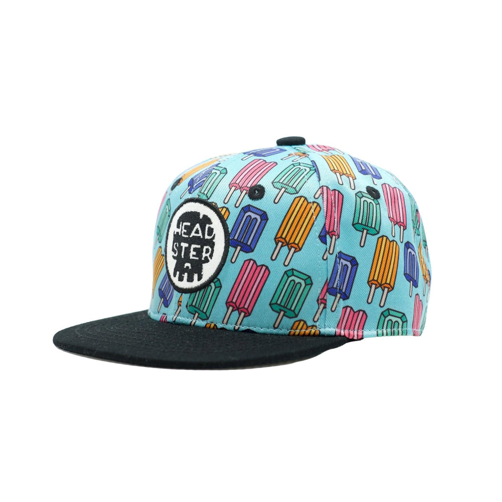 Headster ball cap with bright blue background and multicolor popsicles.